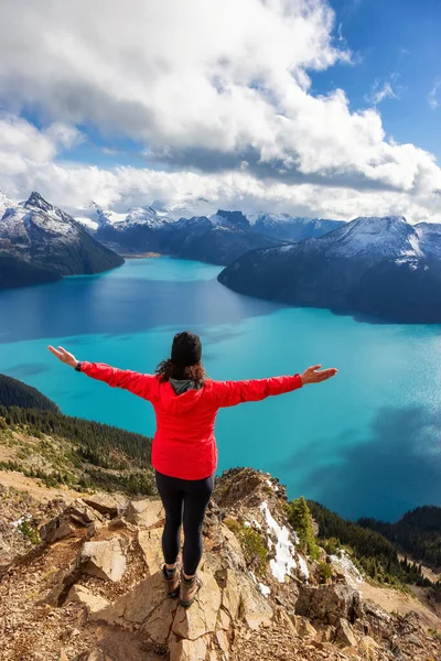 Adventurous Caucasian Woman hiking on top of a Canadian mountain. — Stock Photo, Image