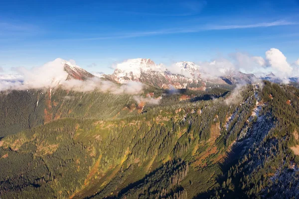 Aerial View of Canadian Rocky Mountains with snow on top during Fall Season. — Stock Photo, Image