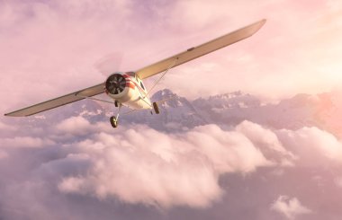 Tek motorlu uçak Rocky Dağı üzerinde uçuyor.