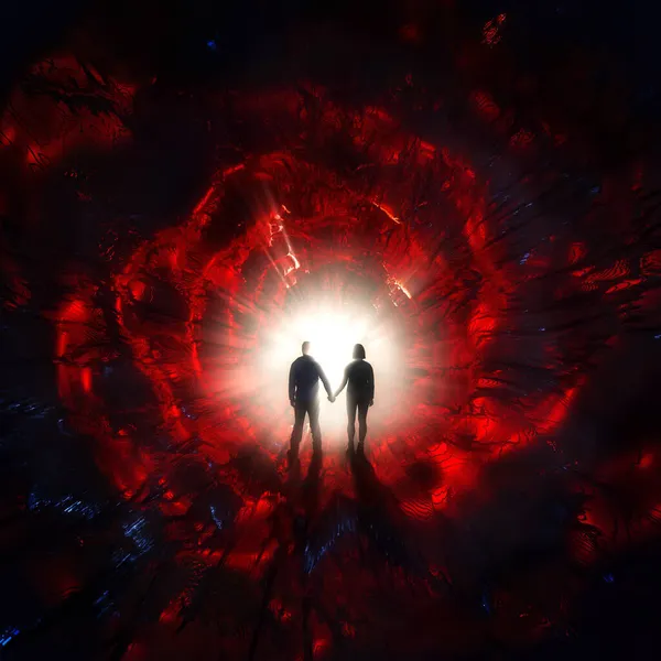 Тёмный абстрактный фон. Красный свет со стоящими мужчиной и женщиной — стоковое фото