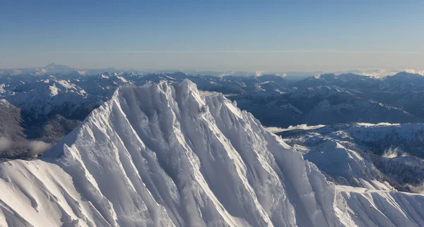 Aerial View of Canadian Mountain covered in snow — Foto Stock
