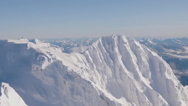Aerial View of Canadian Mountain covered in snow — Stockvideo