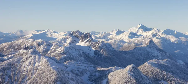 Aerial Panoramic View of Canadian Mountain covered in snow — Stockfoto