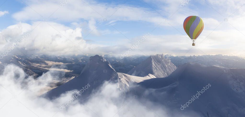 Dramatic Mountain Landscape covered in clouds and Hot Air Balloon Flying