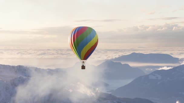 Dramatic Mountain Landscape covered in clouds and Hot Air Balloon Flying — Stock Video