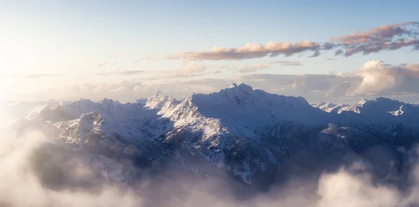 Aerial Panoramic View of Canadian Mountain covered in snow. — Stockfoto
