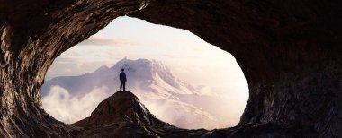 Rocky Cave Landcspae 'nin içinde duran adamla dramatik Macera Sahnesi