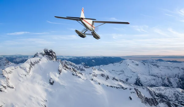 Seaplane flying over the Rocky Mountains. — Stockfoto