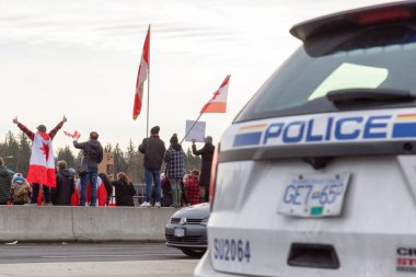 People on the Highway Overpass Supporting the Freedom Rally and the protest of the Truck Drivers against Vaccine Mandate clipart