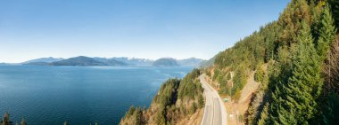 Aerial Panoramic View of Sea to Sky Highway on Pacific Ocean West Coast. clipart