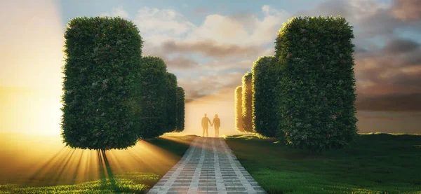 Caminho em um jardim com grama verde e arbustos que levam a um casal de mãos dadas. — Fotografia de Stock