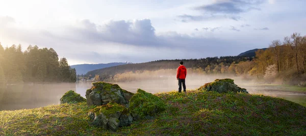 Adventurous Man Standing in Nature. Cloudy Sunset Sky. — Foto Stock