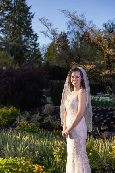 White Caucasian Adult Woman in a Wedding Dress standing outside in nature — Stockfoto