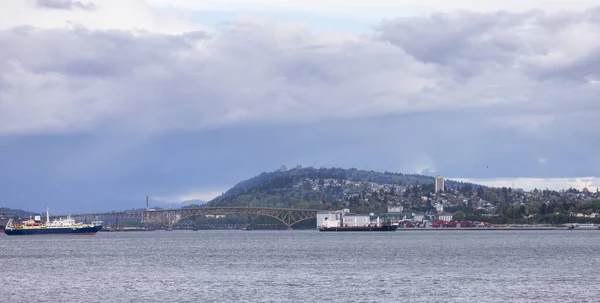 Industrial Sites, Second Narrows Bridge and Burnaby Mountain in Background. Panoramic View. Vancouver, British Columbia, Canada.