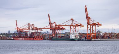 Downtown Vancouver, British Columbia, Canada - May 7, 2022: Panoramic View of Port in a modern city during cloudy day.
