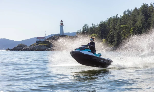 Adventurous Caucasian Woman Sea Doo Riding Ocean Lighthouse Park Background — Stock Photo, Image