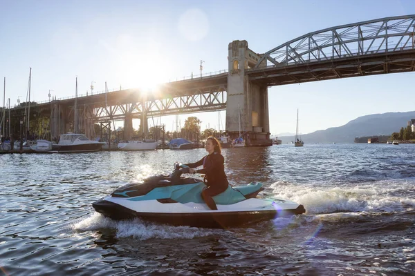 Adventurous Caucasian Woman Water Scooter Riding Ocean Sunny Sunset Sky — ストック写真