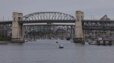 Vancouver, British Columbia, Canada - May 7, 2022: Burrard Bridge in False Creek, Downtown City on the West Coast of Pacific Ocean.