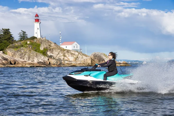 Adventurous Caucasian Woman Water Scooter Riding Ocean Lighthouse Park Background — ストック写真
