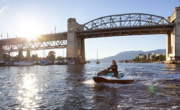 Adventurous Caucasian Woman Water Scooter Riding Ocean Sunny Sunset Sky — Fotografia de Stock