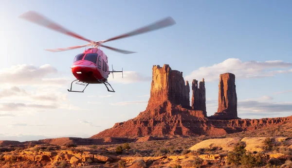 Rocky Dağı Çölü 'nün üzerinde uçan helikopter. Heli 'nin 3D görüntüsü. Günaydın Sunny Sunrise Sky. Oljato-Monument Valley, Utah, ABD.