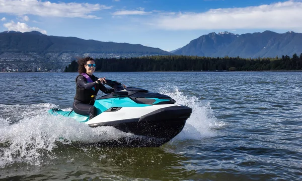 Adventurous Caucasian Woman Jet Ski Riding Ocean Modern City Background — Fotografia de Stock