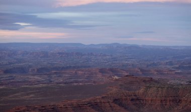 Scenic American Landscape and Red Rock Mountains in Desert Canyon. Spring Season. Canyonlands National Park. Utah, United States. Nature Background. Sunset