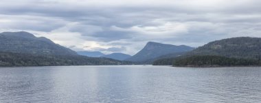Islands surrounded by ocean and mountains. Summer Season. Gulf Islands near Vancouver Island, British Columbia, Canada. Canadian Landscape.