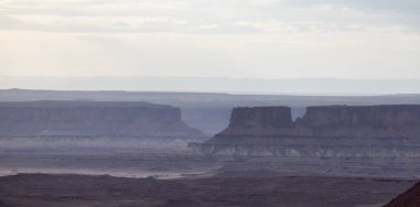 Scenic American Landscape and Red Rock Mountains in Desert Canyon. Spring Season. Canyonlands National Park. Utah, United States. Nature Background. Sunset