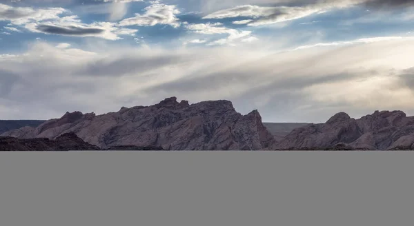 Rugged Mountain Rock Formations Desert Dramatic Clouds Sunset Utah United — Foto de Stock