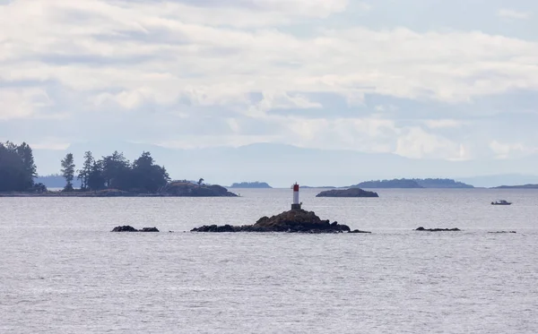 Rocky Island Lighthouse Ocean Surrounding Islands Trees Cloudy Day Summer — Stok fotoğraf