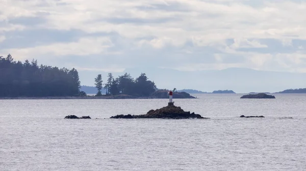 Rocky Island Lighthouse Ocean Surrounding Islands Trees Cloudy Day Summer — Stock Fotó