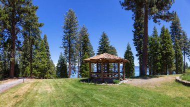 Panoramic View of Gazebo in Park surrounded by Grass and Trees near Lake. Summer Season. Sugar Pine Point Beach, Tahoma, California, United States. Sugar Pine Point State Park. Panorama