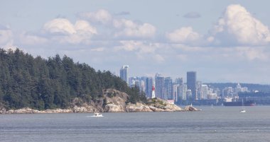 Lighthouse Park, Downtown city and industrial ships and boats during sunny summer day. West Vancouver, British Columbia, Canada.