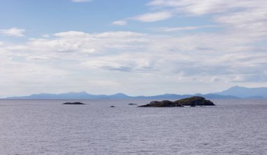 Rocky Islands, Ocean and Mountains on Cloudy Day. Summer Season. Near Nanaimo., Vancouver Island, British Columbia, Canada. Nature Background.