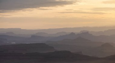 Scenic American Landscape and Red Rock Mountains in Desert Canyon. Spring Season. Canyonlands National Park. Utah, United States. Nature Background. Sunset