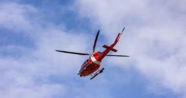 Ucluelet, Vancouver Island, British Columbia, Canada - July 12, 2022: Canadian Coast Garde Helicopter taking of and flying during a sunny summer morning.