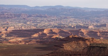 Scenic American Landscape and Red Rock Mountains in Desert Canyon. Spring Season. Canyonlands National Park. Utah, United States. Nature Background. Sunset