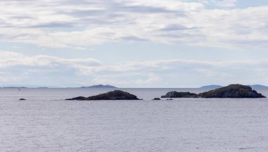 Rocky Islands, Ocean and surrounding Islands on Cloudy Day. Summer Season. Near Nanaimo., Vancouver Island, British Columbia, Canada. Nature Background.