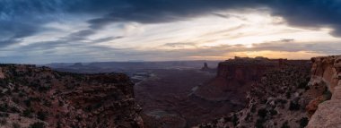 Scenic Panoramic View of American Landscape and Red Rock Mountains in Desert Canyon. Cloudy Sunset Sky. Canyonlands National Park. Utah, United States. Nature Background Panorama