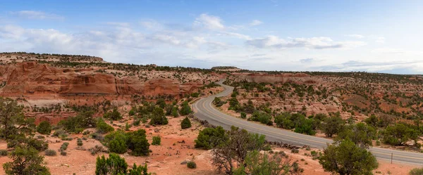 Scenic Road Surrounded Red Rock Mountains Desert Blue Sky Art — Stock Fotó