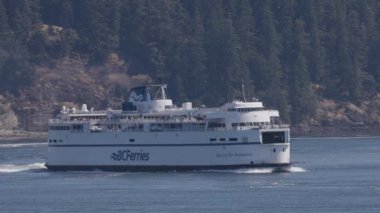 Gulf Islands, British Columbia, Canada - July 14, 2022: BC Ferries Passing By the islands on the West Coast of Pacific Ocean.