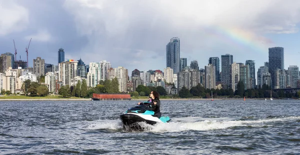 Adventurous Caucasian Woman Water Scooter Riding Ocean Modern City Background — Fotografia de Stock