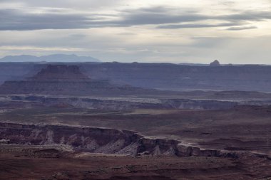 Scenic American Landscape and Red Rock Mountains in Desert Canyon. Spring Season. Canyonlands National Park. Utah, United States. Nature Background. Sunset