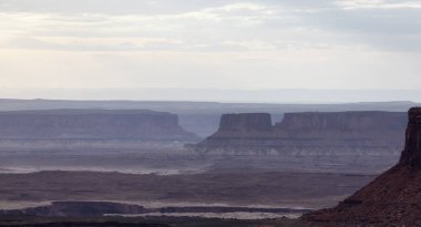 Scenic American Landscape and Red Rock Mountains in Desert Canyon. Spring Season. Canyonlands National Park. Utah, United States. Nature Background. Sunset