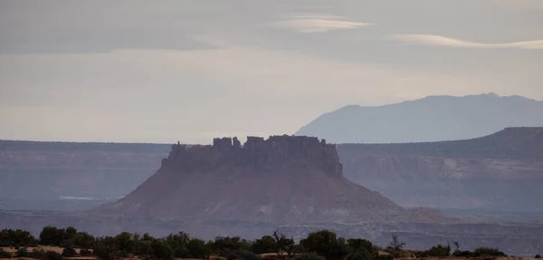 Scenic American Landscape and Red Rock Mountains in Desert Canyon. Spring Season. Canyonlands National Park. Utah, United States. Nature Background. Sunset