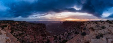 Scenic Panoramic View of American Landscape and Red Rock Mountains in Desert Canyon. Cloudy Sunset Sky. Canyonlands National Park. Utah, United States. Nature Background Panorama