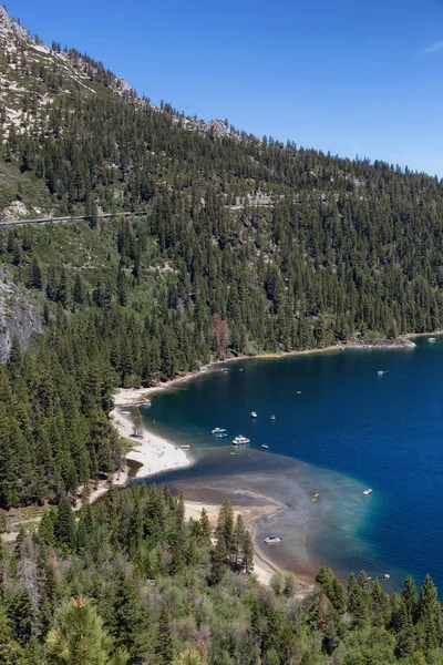 View of Bay with Beaches, Boats, Trees and Mountainside. Summer Season. Emerald Bay, Lake Tahoe. California, United States. Nature Background.