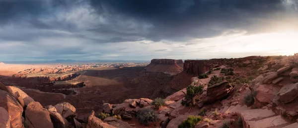 Scenic Panoramic View of American Landscape and Red Rock Mountains in Desert Canyon. Cloudy Sunset Sky. Canyonlands National Park. Utah, United States. Nature Background Panorama