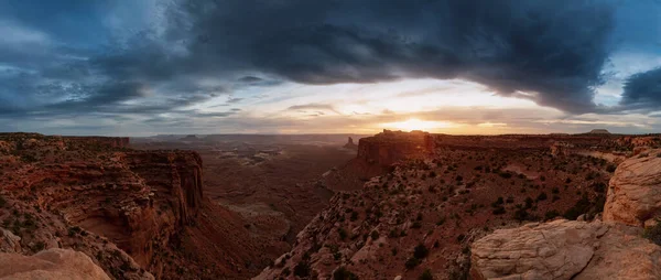 Scenic Panoramic View of American Landscape and Red Rock Mountains in Desert Canyon. Cloudy Sunset Sky. Canyonlands National Park. Utah, United States. Nature Background Panorama